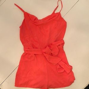 Coral romper with sash tie at wait. Size M. Worn few times in good condition.